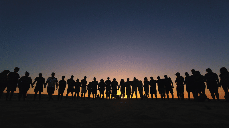 Group of people standing together in a semi circle